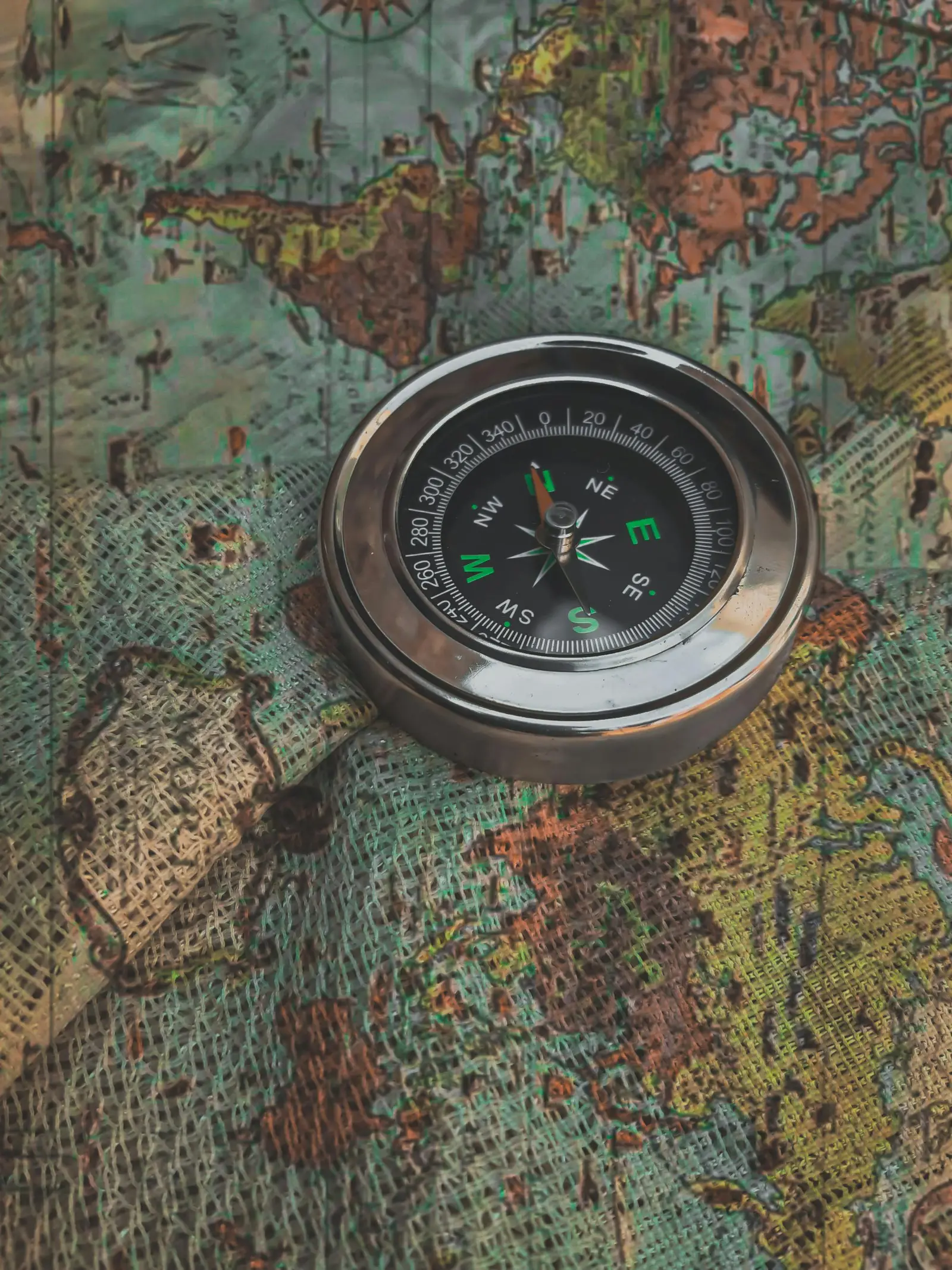 A compass on a world map—planned exploration