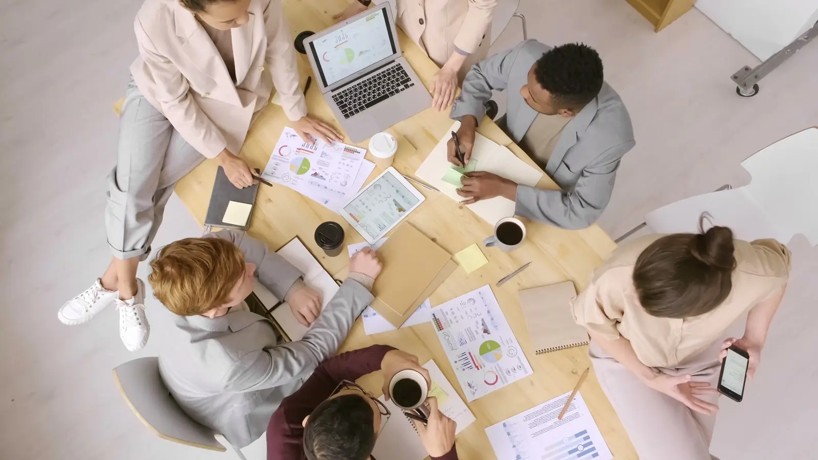 A team discussing charts in a meeting
